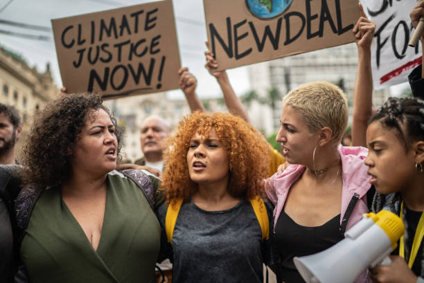 istock Protesters during a demonstration in the street 1385769303
