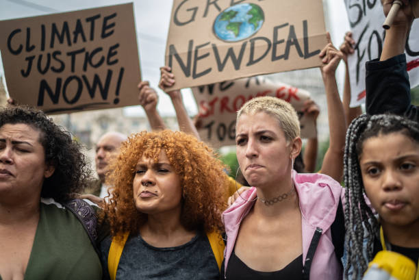 istock Protesters during a demonstration in the street 1385769314