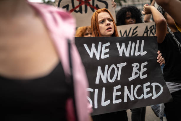 istock Protesters holding signs during on a demonstration for peace 1385771088