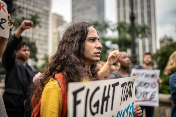 istock Protesters holding signs during on a demonstration outdoors 1385771114