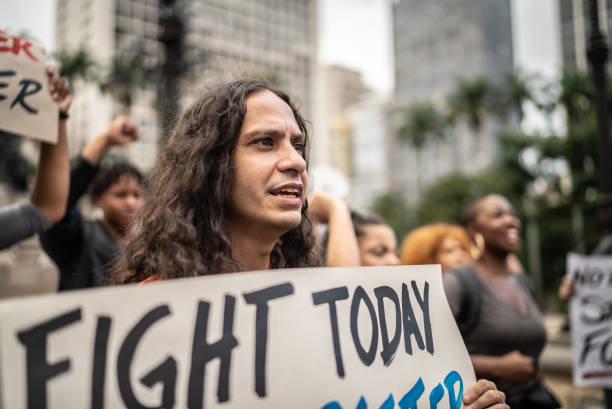 istock Protesters holding signs during on a demonstration outdoors 1385771127