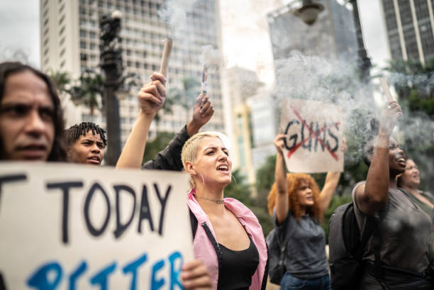 istock Protesters holding signs during on a demonstration outdoors 1385771130
