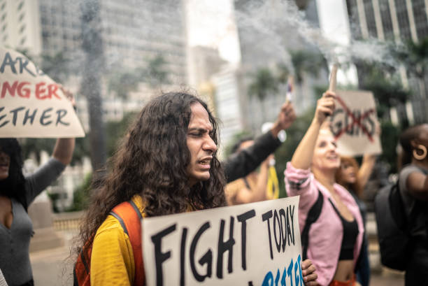 istock Protesters holding signs during on a demonstration outdoors 1385771134