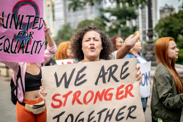 istock Woman on a demonstration for equal rights 1385771256