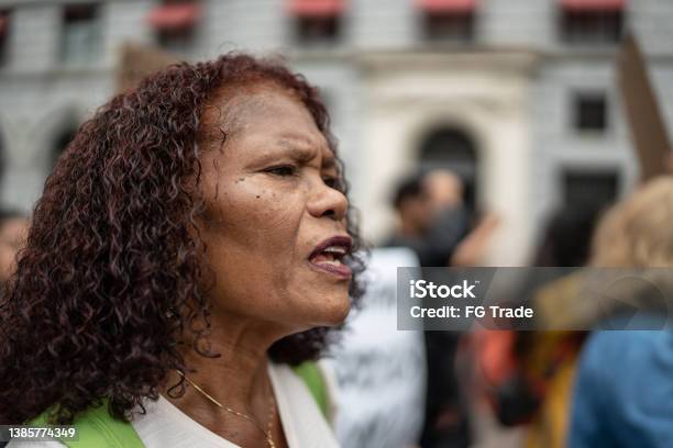 Senior woman marching on a protest