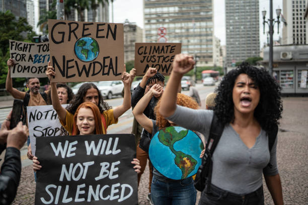 istock Protesters holding signs during on a demonstration for environmentalism 1385774358
