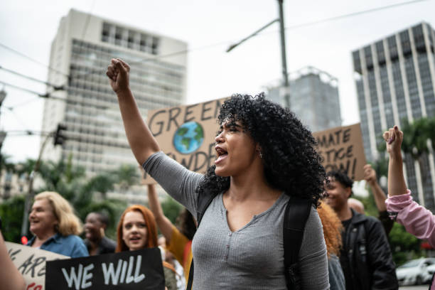 istock Protesters holding signs during on a demonstration for environmentalism 1385774359