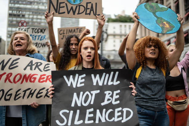 istock Protesters holding signs during on a demonstration for environmentalism 1385774364