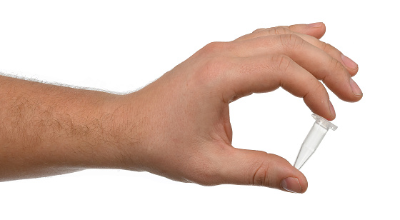 an empty eppendorf test tube with a man's hand without gloves on a white isolated background