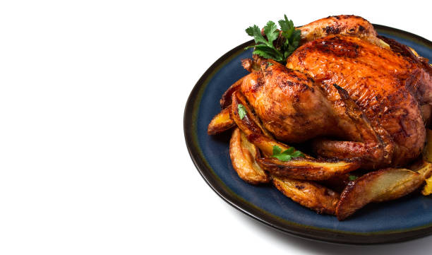istock Fried whole chicken, with potatoes, on a white background, no people. 1385778892