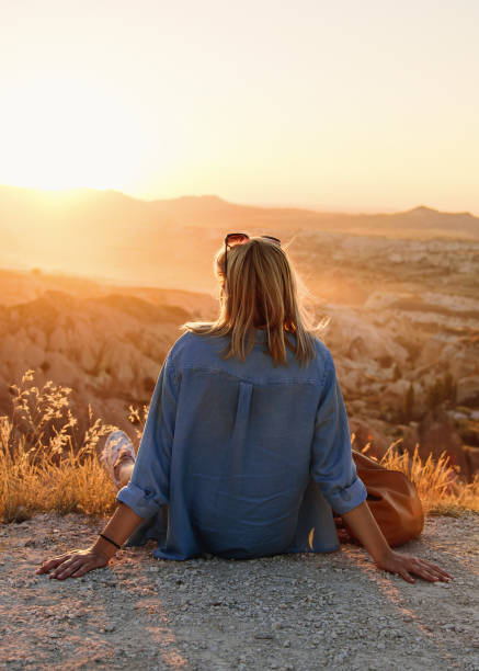 istock Woman enjoying sunset 1385781139