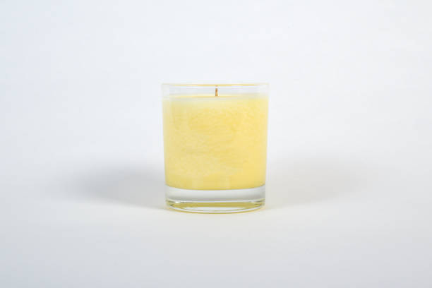 istock Scented candle in plain glass jar isolated on white background 1385785130