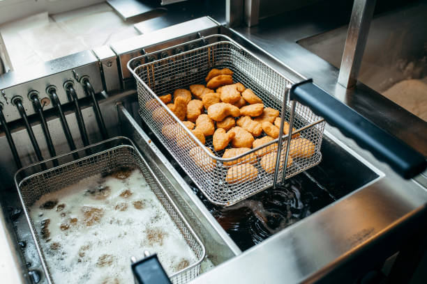 Deep fryers and grill, equipment of a fast food restaurant Deep fryers and grill, equipment of a fast food restaurant deep fryer stock pictures, royalty-free photos & images