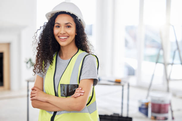 istock Shot of an attractive young contractor standing alone inside with her arms folded 1385786915