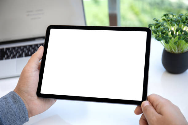istock male hands holding computer tablet with isolated screen in office 1385788166