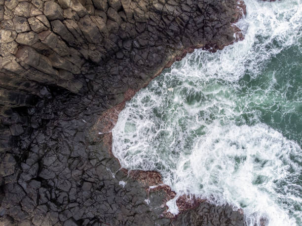 istock Aerial view of waves breaking on Basaltic volcanic columns, background with copy sapce 1385788291