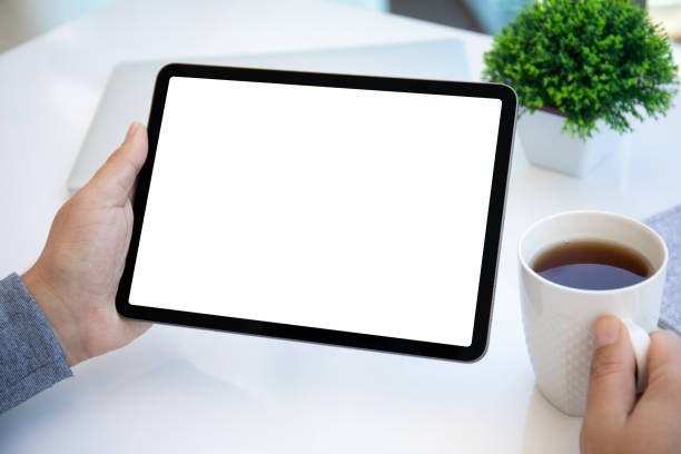 istock male hands holding computer tablet with isolated screen in office 1385788311