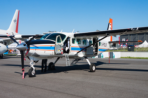 Berlin, Germany - May 25, 2014: Commercial plane at airport and airfield. Small and sport aircraft. General aviation industry. Vip transport. Civil utility transportation. Fly and flying.