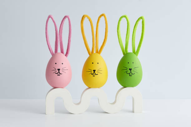 istock Colorful Easter eggs with bunny faces, holiday decoration 1385788415