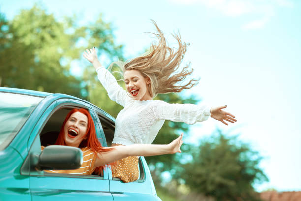 istock Girls having fun on a roadtrip. 1385790095