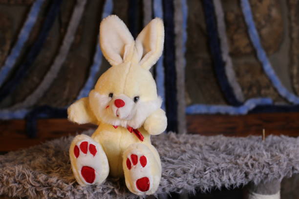 istock Easter stuffed baby bunny with beige, red and white coloring 1385795268