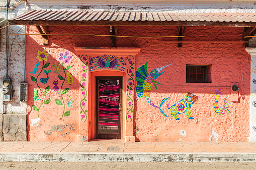 Mulege, Baja California Sur, Mexico. November 14, 2021. A building decorated with brightly painted fish, birds and other animals.