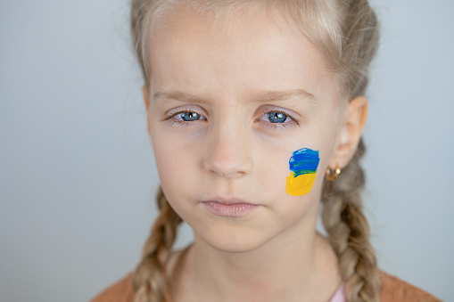 Portrait of a Sad Ukrainian Girl Looking at Camera - Conceptual Symbol