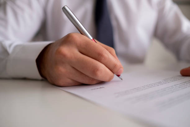 Signing Official Document Signing Official Document lawyer stock pictures, royalty-free photos & images