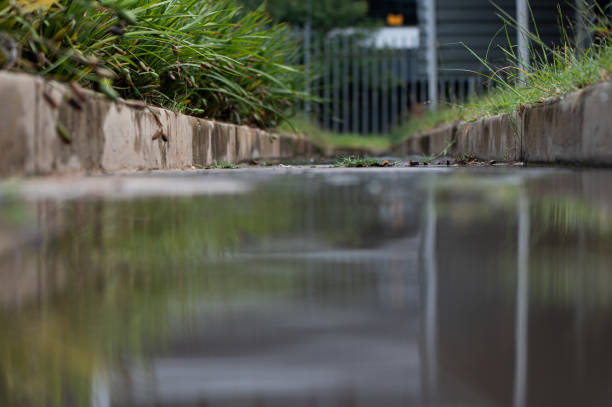 istock Abstract view of a water drain  with a low angle 1385796353