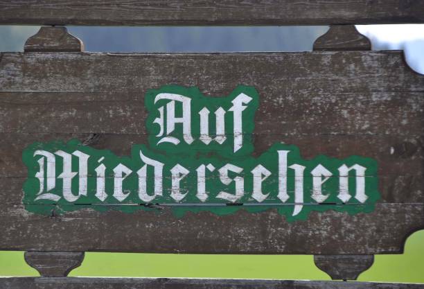 good bye sign (german: Auf Wiedersehen) a good bye or farewell sign in german: Auf Wiedersehen civilized stock pictures, royalty-free photos & images