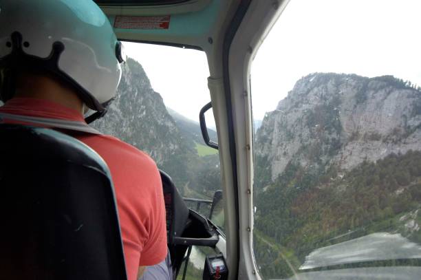 istock pilot takes flying lessons in a helicopter 1385796999