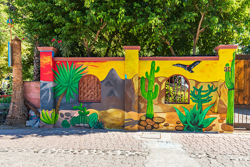 Loreto, Baja California Sur, Mexico. November 17, 2021. A wall decorated with a colorful desert scene.