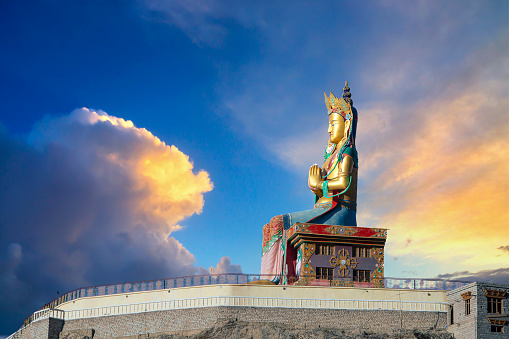 Huge statue of Maitreya Buddha (the future Buddha) near Diskit Monastery in the hidden Nubra Valley facing down the Shyok River towards Pakistan. The statue is 32 meters (106 ft) high. Diskit monatery (gompa)  is the oldest and largest Buddhist monastery in the Nubra Valley of Ladakh and it It belongs to the Gelugpa (Yellow Hat) sect of Tibetan Buddhism.