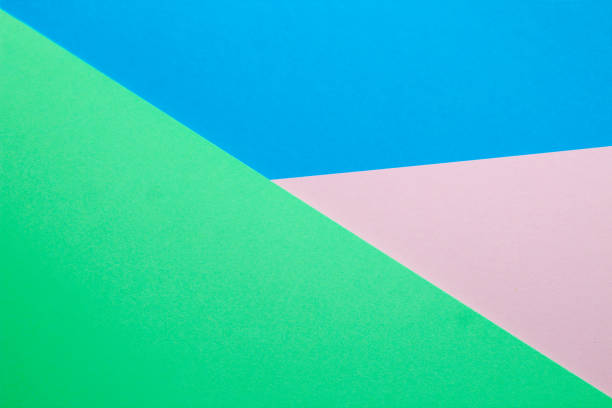 istock Abstract background with colored paper blue with pink and green color 1385800713