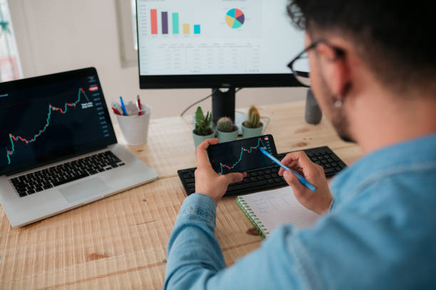 istock Rear view close up of a young Caucasian male freelancer working at home using a computer 1385802367