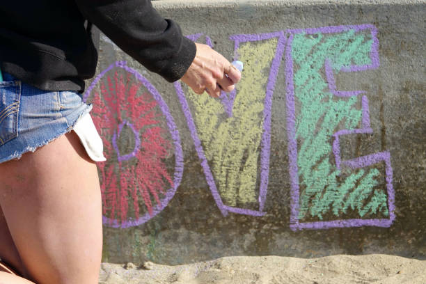 Girl coloring with sidewalk chalk at Main beach