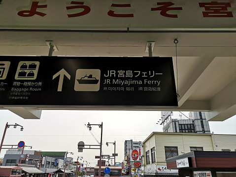 March 25, 2019 - Miyajimaguchi, Japan: JR Miyajima Ferry Terminus sign to Itsukushima Island