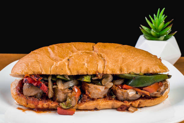 istock sausage peppers and onion sub with sauce 1385830653