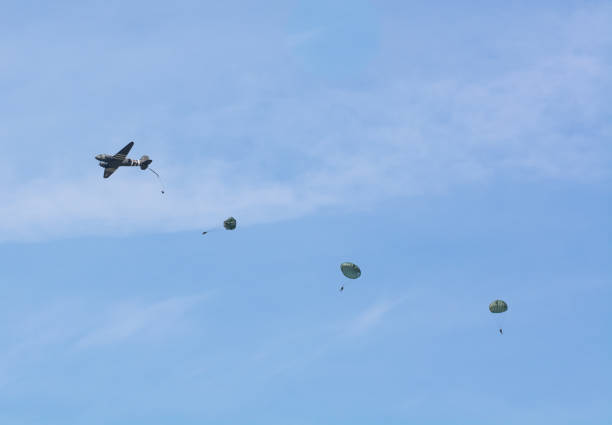 Paraglider in a blue sky.