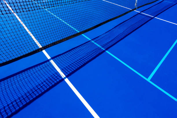 istock Blue tennis court and black net 1385843465