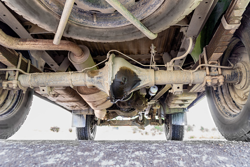 oil leakage from the rear axle gearbox leads to a lack of lubrication and the destruction of the gears of the drive mechanism to the drive wheels, selective focus