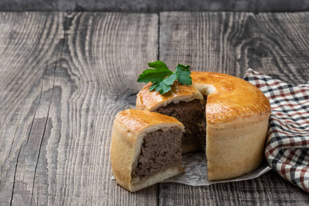 istock Homemade Meat pie on wooden table 1385845619