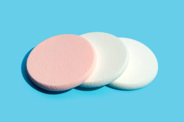istock Sponge for face make-up cleaning on blue background 1385847830