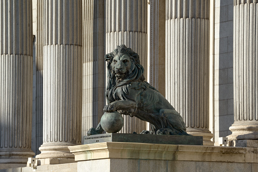 Lion sculpture in the Congress of Deputies (Congreso de Los Diputados), Spanish Parliament, Palacio de las Cortes, Madrid. Translation: Cast of cannons taken to the enemy in the War of Africa in 1860