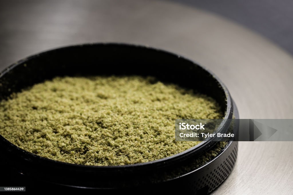 Kief Kief collected in the bottom portion of the grinder Marijuana - Herbal Cannabis Stock Photo