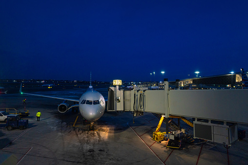 New York airport at night, plane at the gates