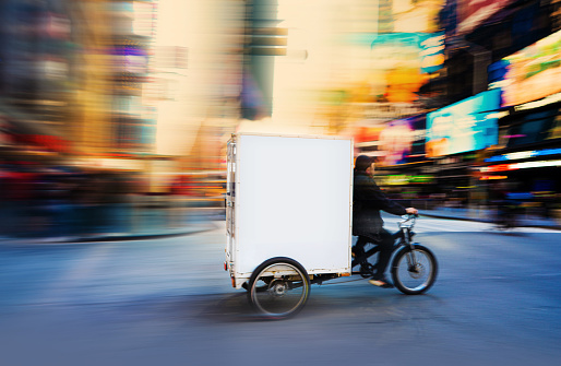 Tricycle delivery rushing in the city