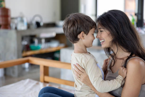 istock Loving mother playing with her son at home 1385872154