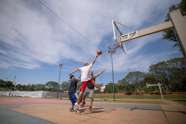 istock playing basketball in the park 1385872413
