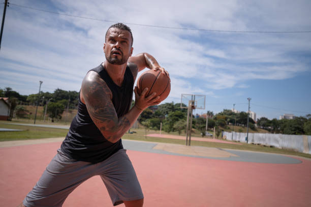 istock playing basketball in the park 1385872421